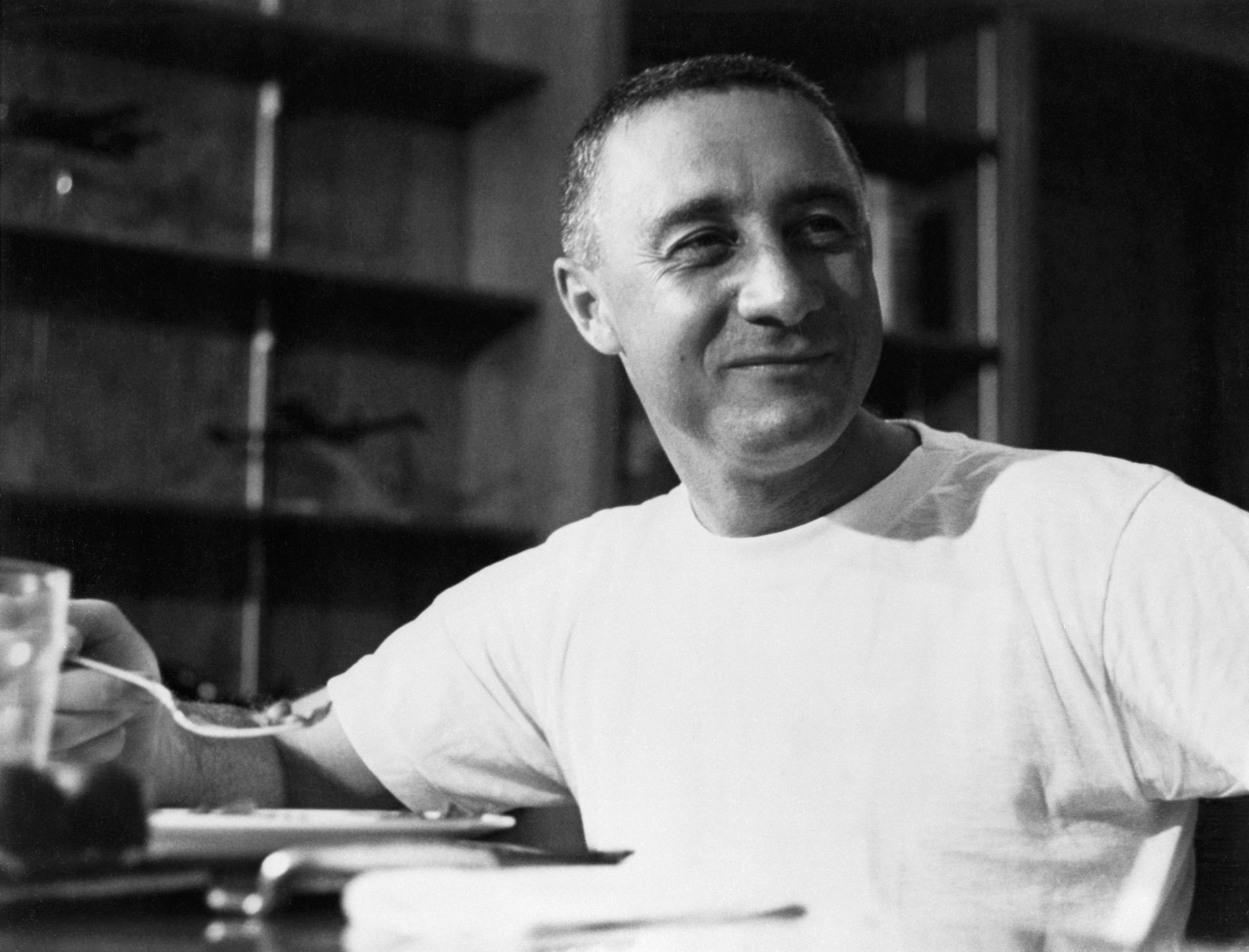 Grissom wears a t-shirt while eating a meal after his Mercury-Redstone 4 flight.